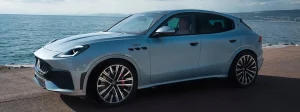 A Maserati Grecale Trofeo driving next to the water